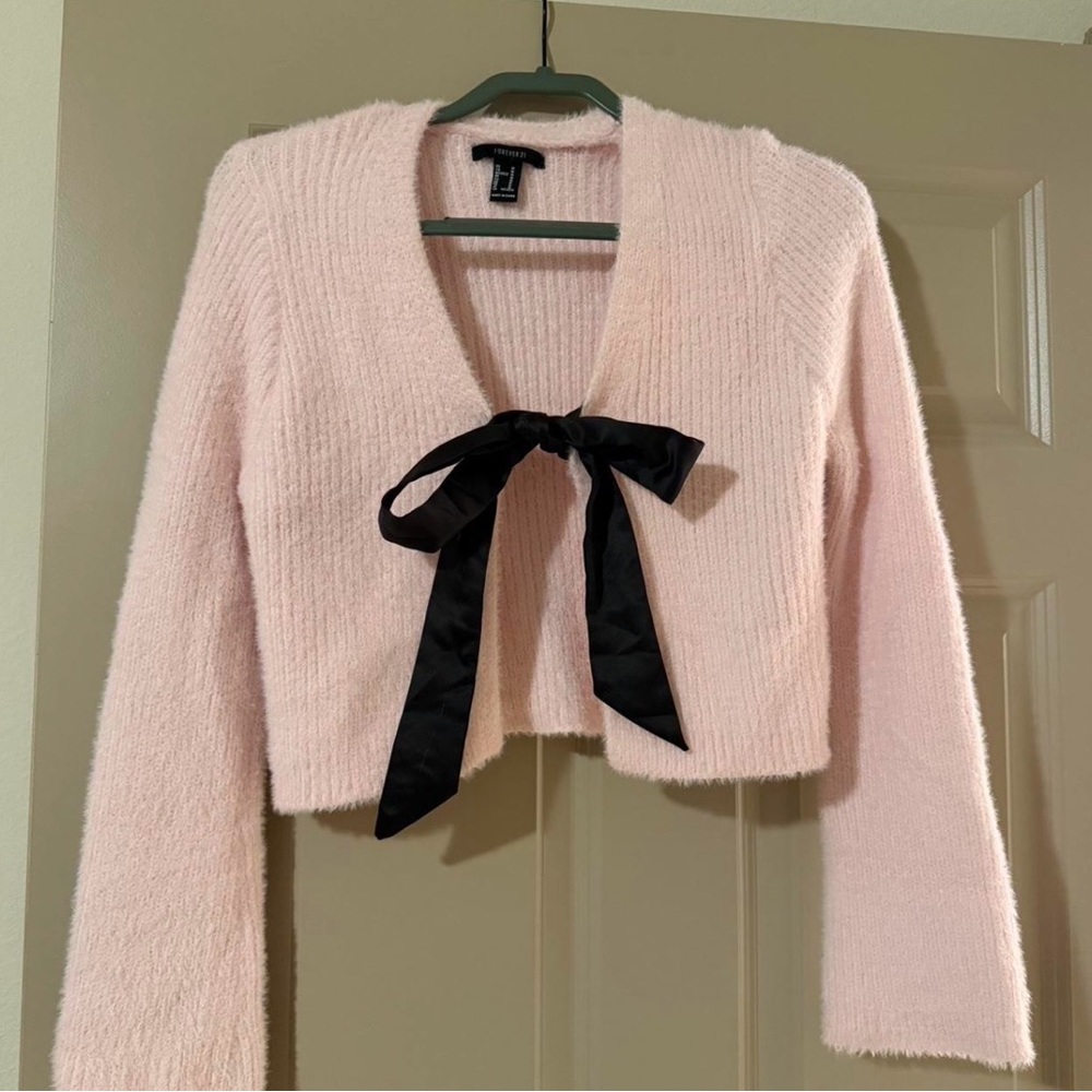 Pink fuzzy cardigan with Black Bow